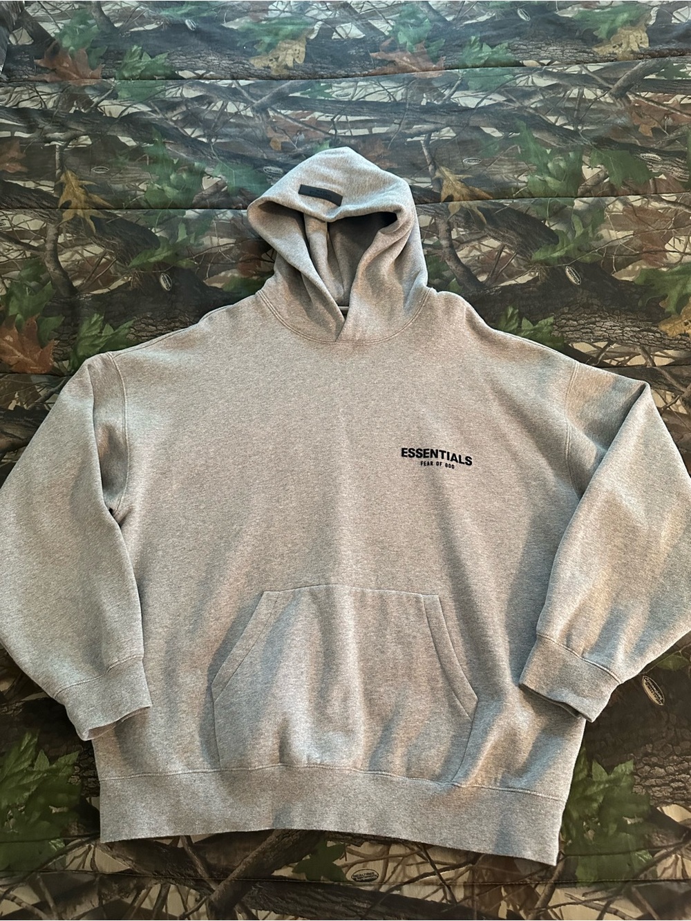 Essentials Men's Light Gray Pullover Hoodie with Minimal Logo